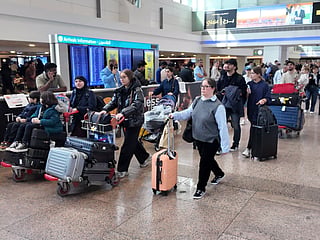 Passengers disembark at Dubai International Airport Terminal 1 as UAE families return from their summer holidays. Travel agents say strong back-to-school demand, higher fuel costs and ongoing geopolitical uncertainty are keeping airfares from India to the UAE elevated.