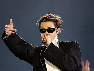 This handout photo taken on March 21, 2026 and provided by Bright Music and Netflix shows K-pop boy group BTS member RM performing during their comeback concert at the Gwanghwamun Square in Seoul.