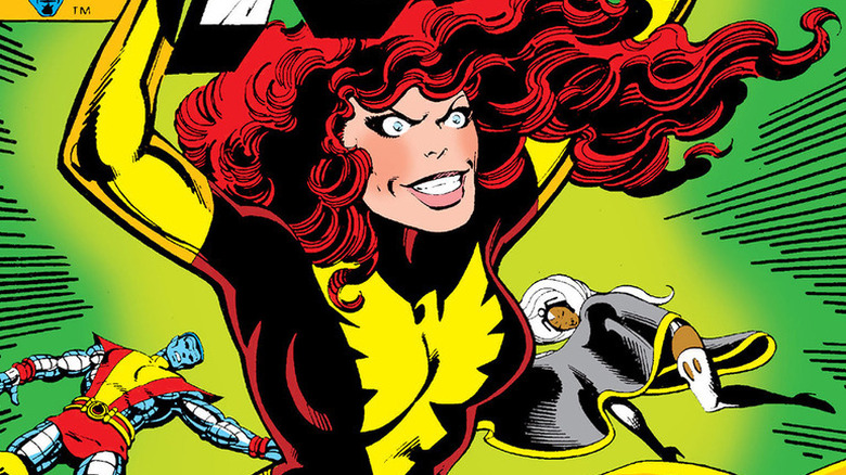 Jean Grey as Dark Phoenix with Colossus and Storm lying on the ground on the cover of X-Men #135