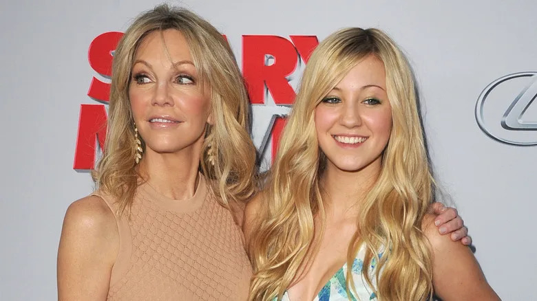 Heather Locklear and Ava Sambora smiling on the red carpet in 2013