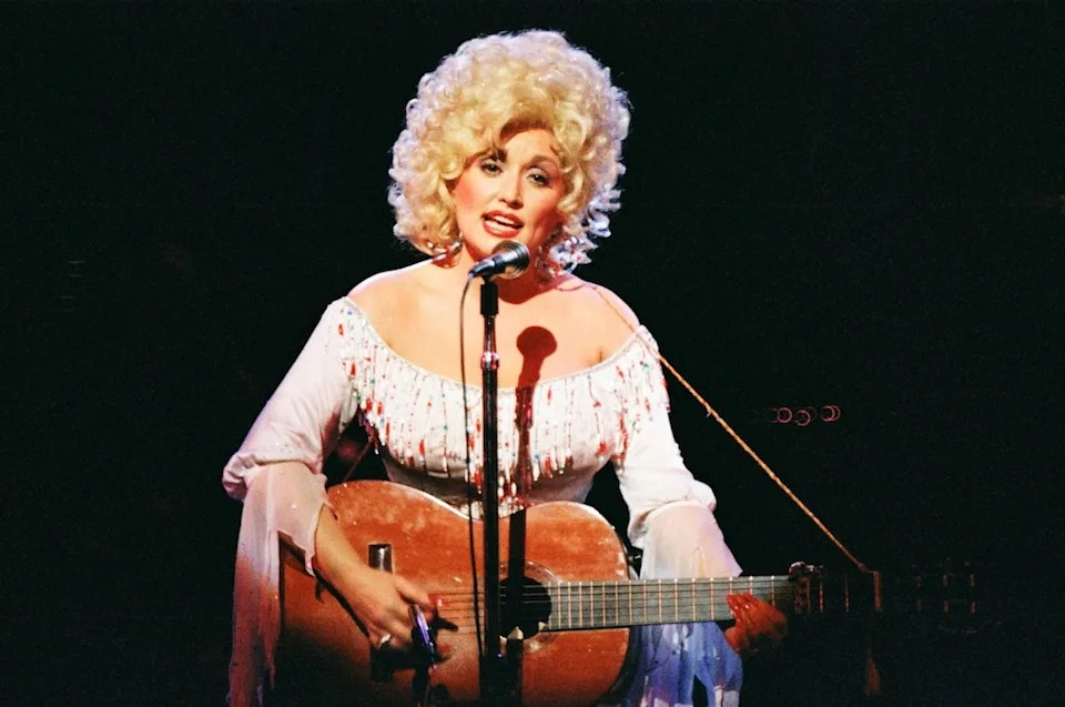 <p>1. Raised by farmer <strong>Robert Lee Parton</strong> and his homemaker wife <strong>Avie Lee </strong>in a tiny cabin near Tennessee's Great Smoky Mountains, <a href="https://www.eonline.com/news/dolly_parton" target="_blank"><strong>Dolly Parton</strong></a> "grew up in a very poor family with no material things," the singer told <em>People</em> in December 2018. "I had to claw and scratch my way through everything."</p><p>2. A hustler from the start, Parton's dad famously paid the doctor who helped deliver her—the fourth of 12 children—with a bag of cornmeal. </p><p>3. The singer learned to make do early on. With no running water, they'd bathe in the river during summer months and "in the winter time, we just had a pan of water and we'd wash down as far as possible, and we'd wash up as far as possible," she told <em>Playboy</em> in 1978. "Then, when somebody cleared the room, we'd wash 'possible.' That's the way it was."</p>