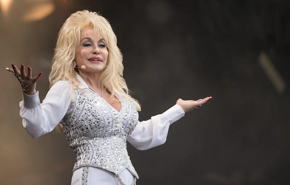 <p>13. For Parton, her glam look wasn't just for her 9 to 5. Her obsession with <a href="https://www.eonline.com/news/1388122/dolly-parton-reveals-why-shes-been-sleeping-in-her-makeup-since-the-80s" target="_blank">always having a full face</a> began "when I arrived in LA in the '80s," she <a href="https://www.eonline.com/photos/36369/booktoks-top-15-obsessions" target="_blank">wrote in her 2023 book</a> <em>Behind the Seams: My Life in Rhinestones</em>. "I started sleeping with my makeup on, partly because of the earthquakes. I thought, 'I'm not heading out on the streets without makeup in case there are cameras out there! I'm going to be ready to go!'"</p><p>Plus, she reasoned, "I don't want to go to bed looking like a hag with Carl."</p><p>14. And beneath her blinged out clothes, she was fully dolled up, <a href="https://www.eonline.com/news/1305111/dolly-parton-finally-reveals-the-truth-behind-rumors-about-her-tattoos" target="_blank">confirming a long whispered-about rumor</a> to E! News in 2017. </p><p>"I have a tendency to scar easy and I'm so fair-skinned that I stay purple around where I've had a scar, so I started having little pastel tattoos, little butterflies or little things to just cover scars," she explained. "I don't look like a biker chick or nothing, but if I was younger and could ride a bike, I might. All of mine are pastels. They're just scattered here and there, where I need them, but they're not the kind of thing to show on television usually. I can't get naked, can I?"</p>