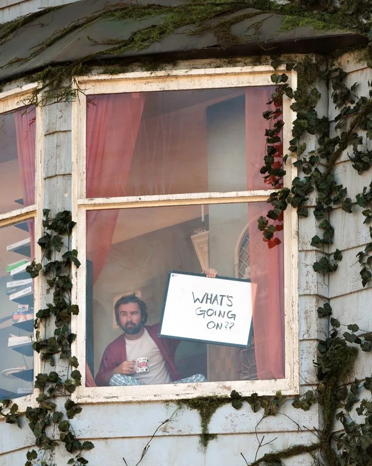 Man living inside Netflix billboard communicates with passersbyCredit: Joel Barhamand/Netflix