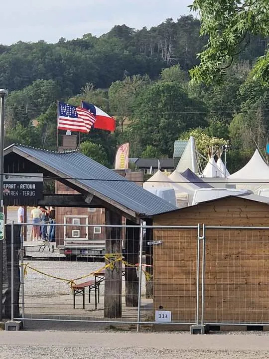 American and Texas flags at the Country & Western Fest in the Belgian Ardennes in July, 2026. (Photo courtesy: Krys Copeland)