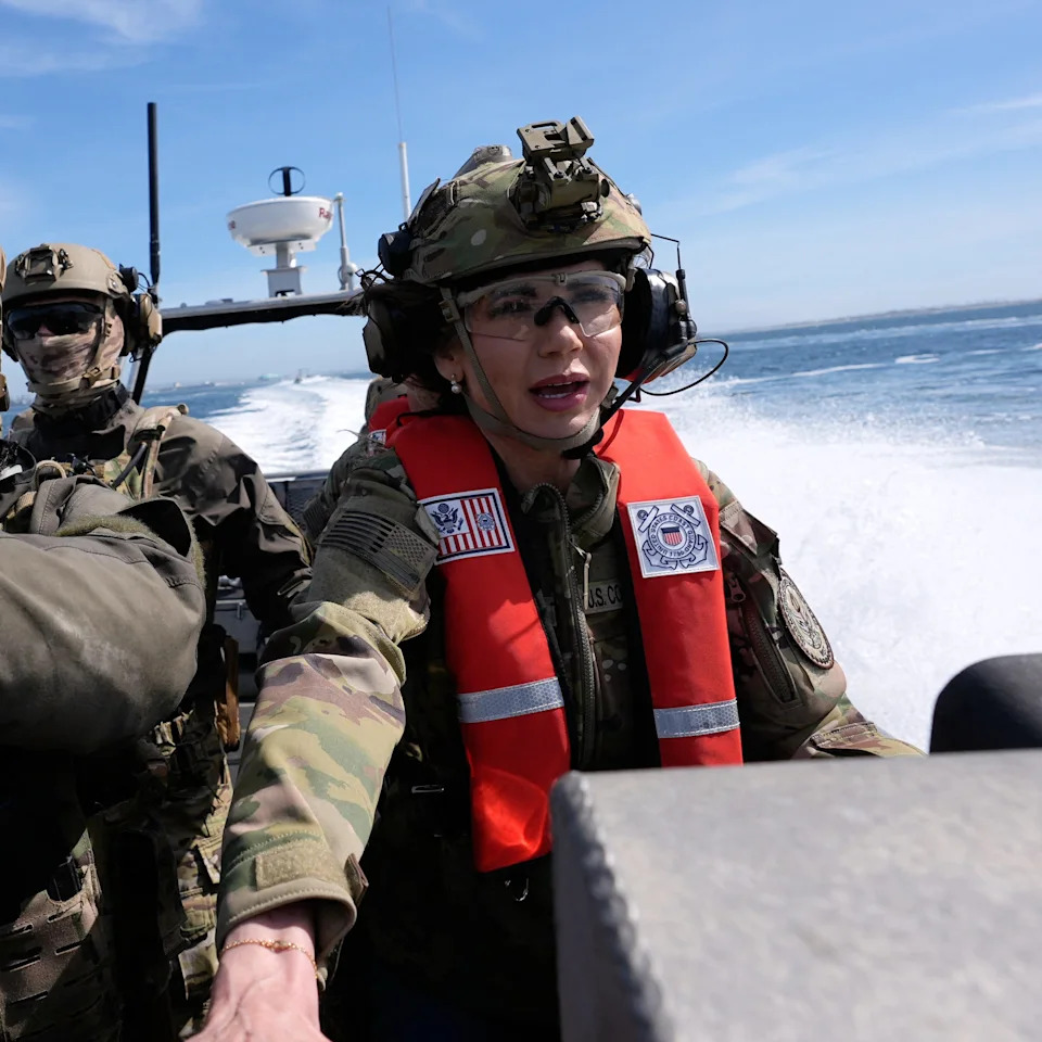 US Secretary of Homeland Security Kristi Noem (R) pilots a US Coast Guard Response Boat-Small (RBS) with the Maritime Security Response Team in San Diego, California, on March 16, 2025. / Pool/AFP via Getty Images