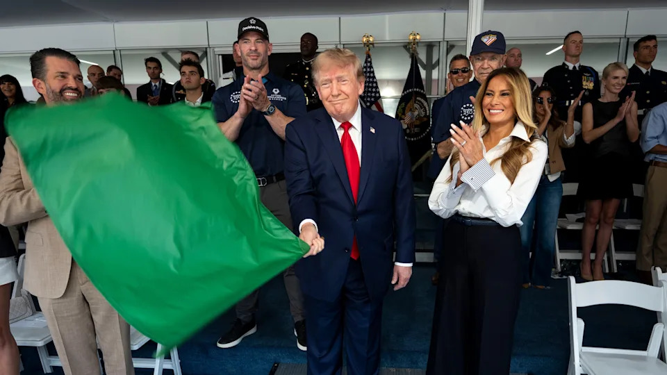 WASHINGTON, DC - AUGUST 23: U.S. President Donald Trump waves the green flag to start the race with first lady Melania Trump and Donald Trump Jr. at the NTT INDYCAR Series on August 23, 2026 in Washington, DC. U.S. President Donald Trump established the Freedom 250 Grand Prix weekend as part of the yearlong celebration of America's 250th anniversary. (Photo by Doug Mills - Pool/Getty Images) / Pool / Getty Images