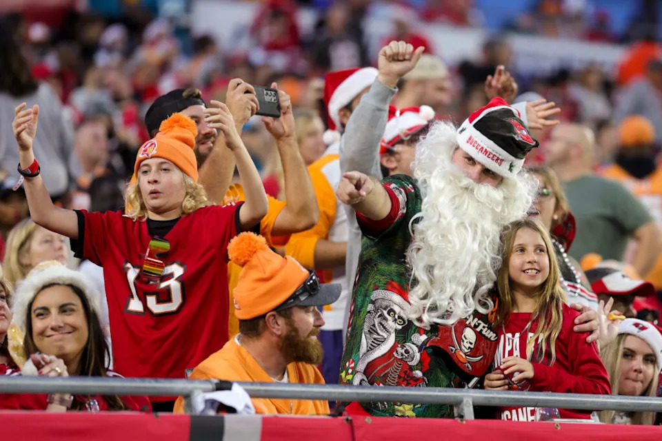 Dec 24, 2023; Tampa, Florida, USA; fans watch a game between the Jacksonville Jaguars and Tampa Bay Buccaneers on Christmas Eve at Raymond James Stadium. Mandatory Credit: Nathan Ray Seebeck-USA TODAY Sports