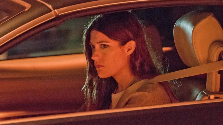 Debra Morgan sitting alone in a car at night in "Dexter" Season 8
