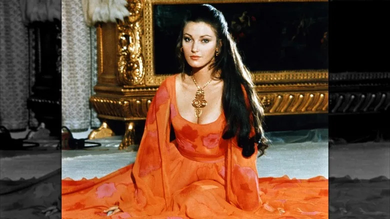 Jane Seymour posing in a red dress in 1973