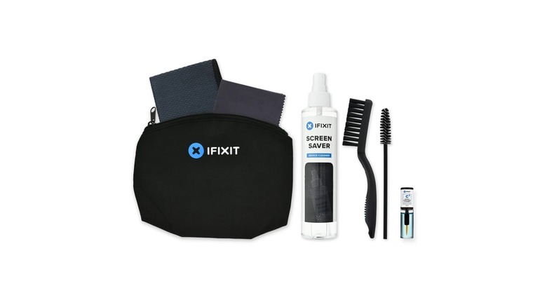 A black bag with various tech cleaning products next to it