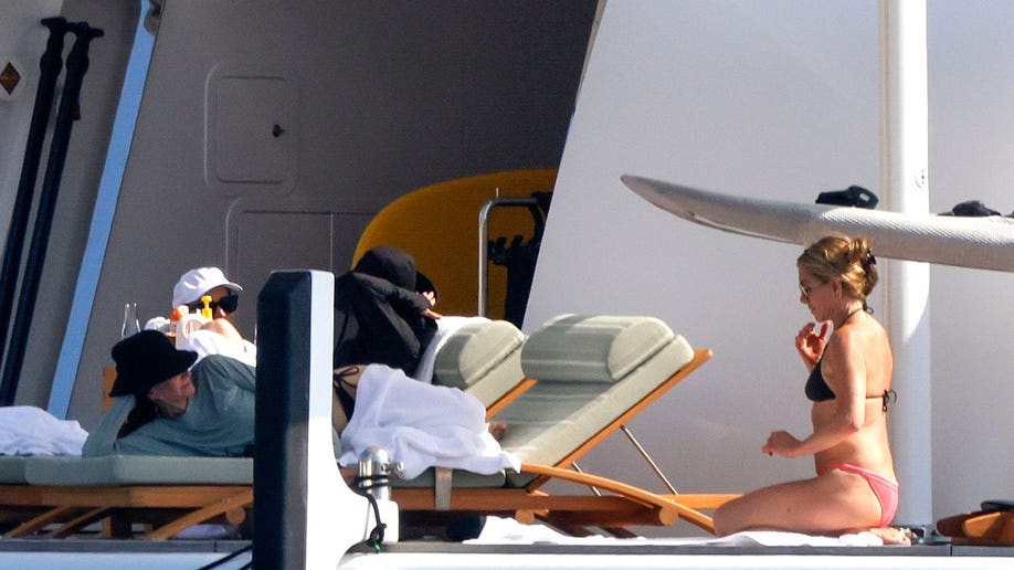 Jennifer Aniston and Courteney Cox on a yacht off the coast of Mallorca while on vacation in July 2026.