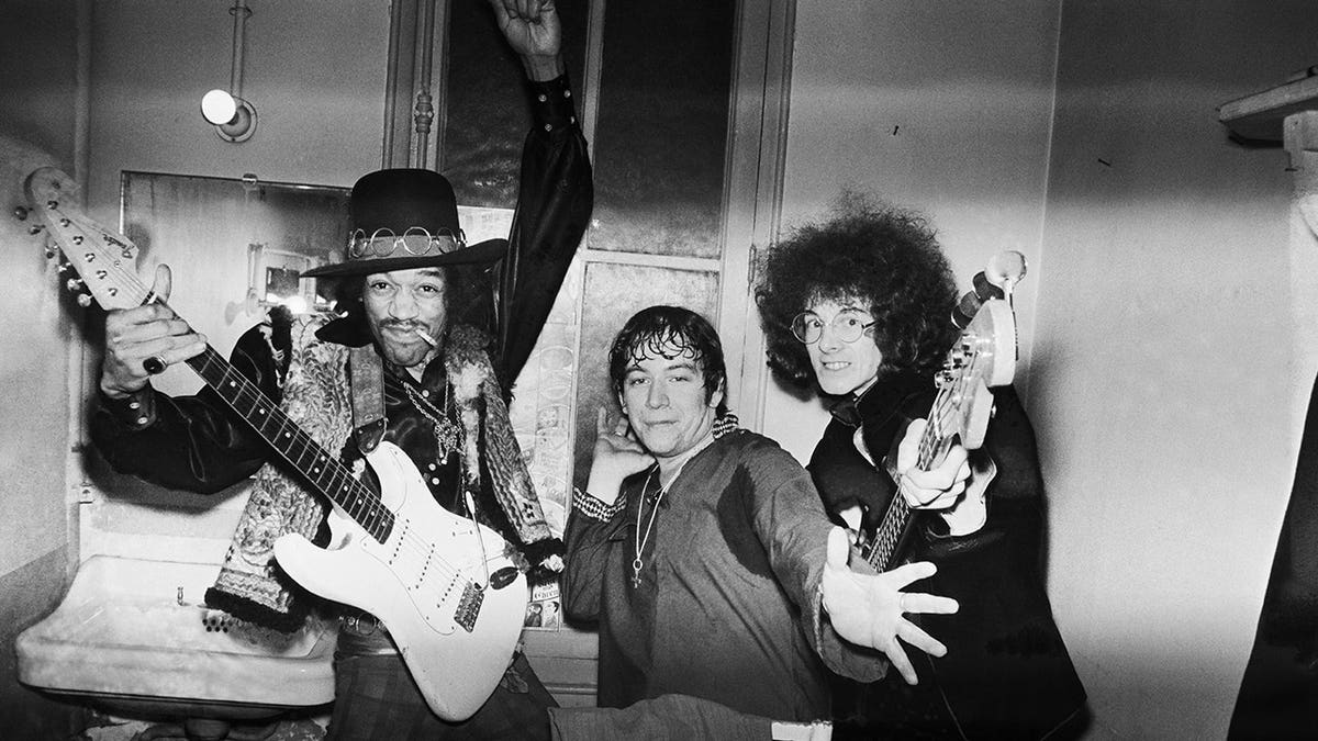 Jimi Hendrix, Eric Burdon and Noel Redding pose together.