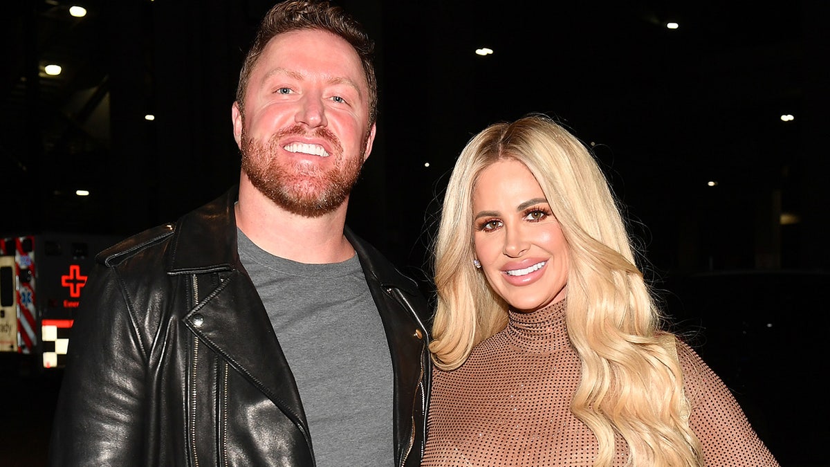 Kim Zolciak wears sheer bodysuit with husband Kroy Biermann
