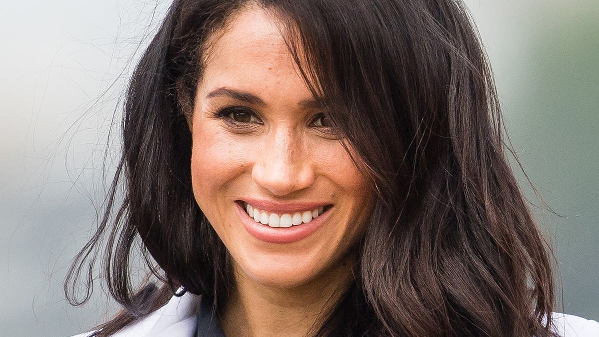 Meghan, Duchess of Sussex smiles while attending the Jaguar Land Rover Driving Challenge at the Invictus Games in Sydney.
