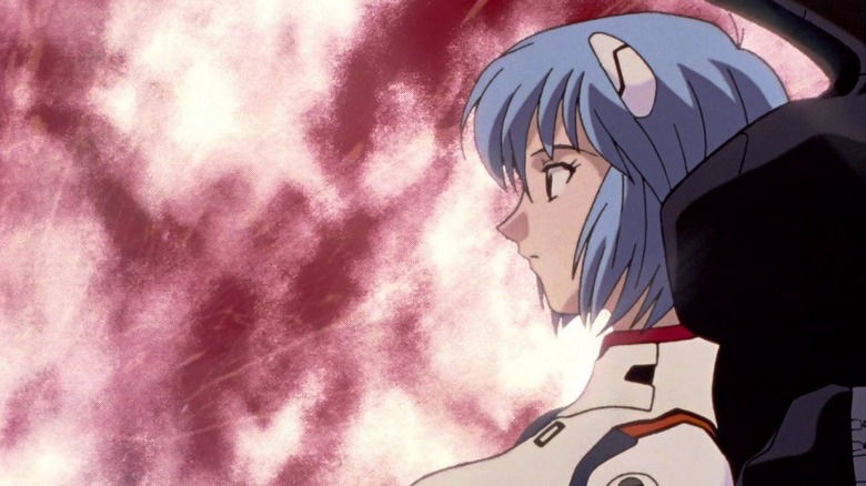 Rei sitting in profile against a red sky in Neon Genesis Evangelion