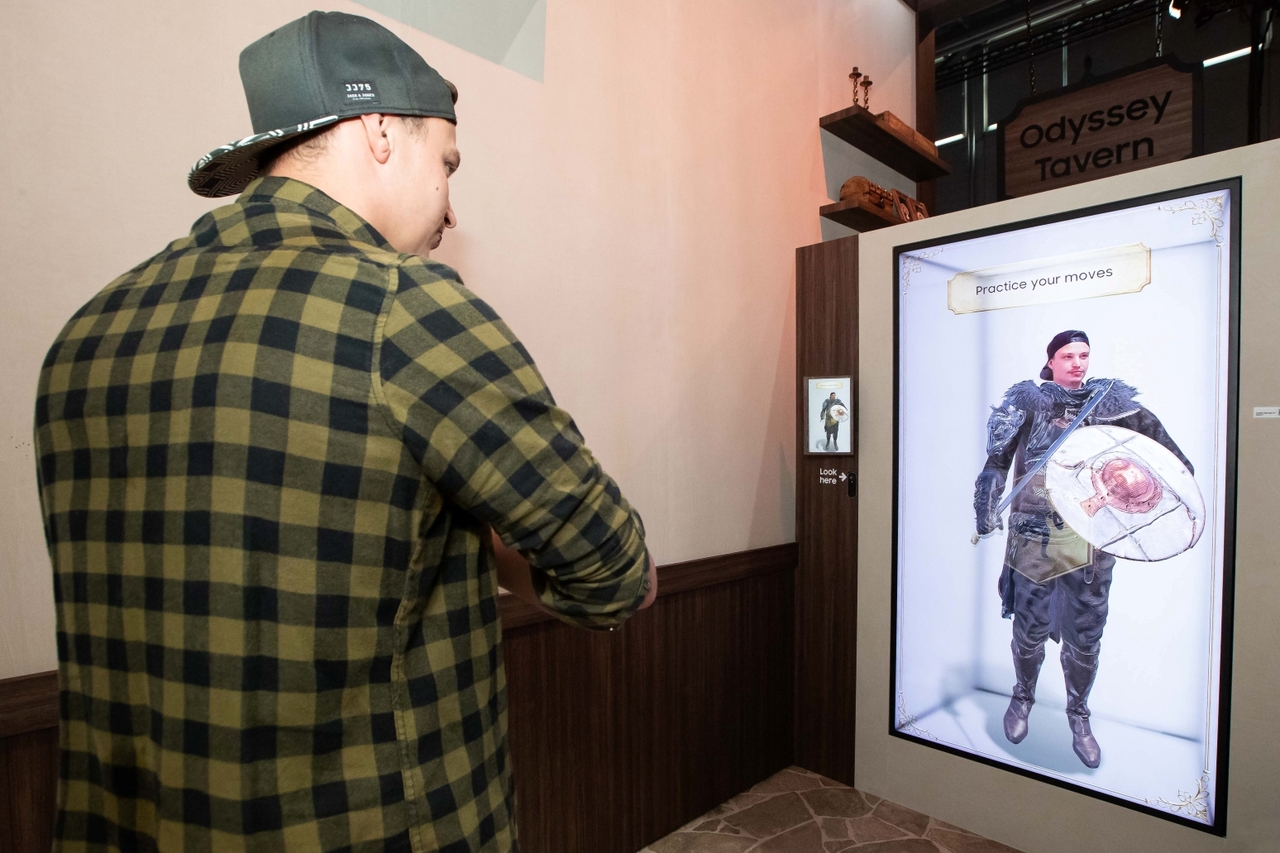 Samsung Spatial Signage displays a visitor transformed into a game character by an interactive solution at the Crimson Desert zone in immersive 3D. (Samsung Electronics)