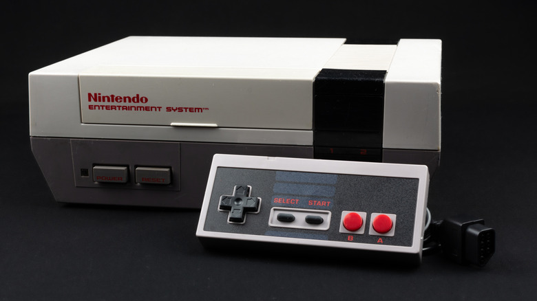 The Nintendo Entertainment System game console on a gray surface