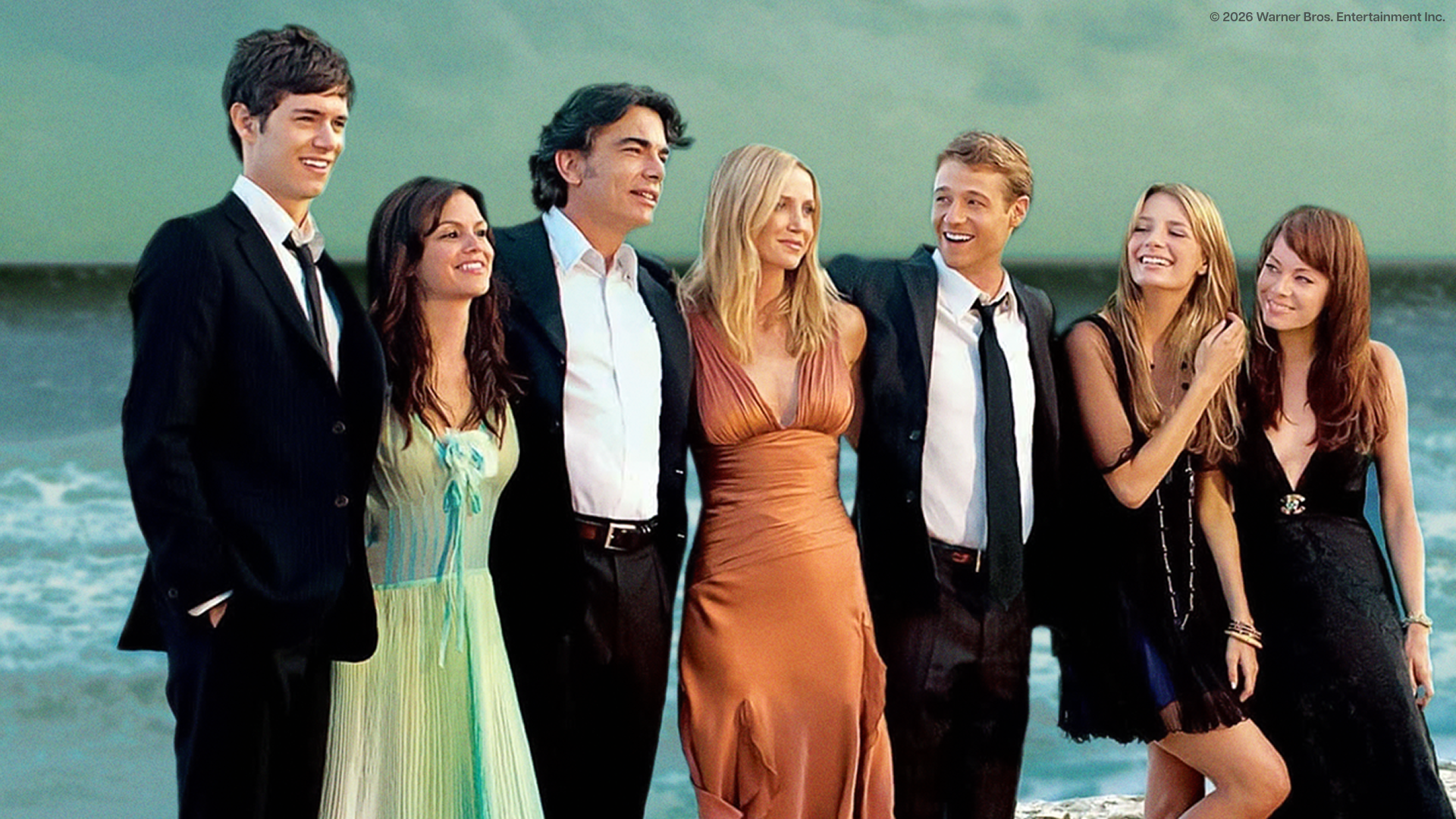 This image shows the main cast of the popular early 2000s teen drama series The O.C., featuring actors Mischa Barton, Adam Brody, and Peter Gallagher.