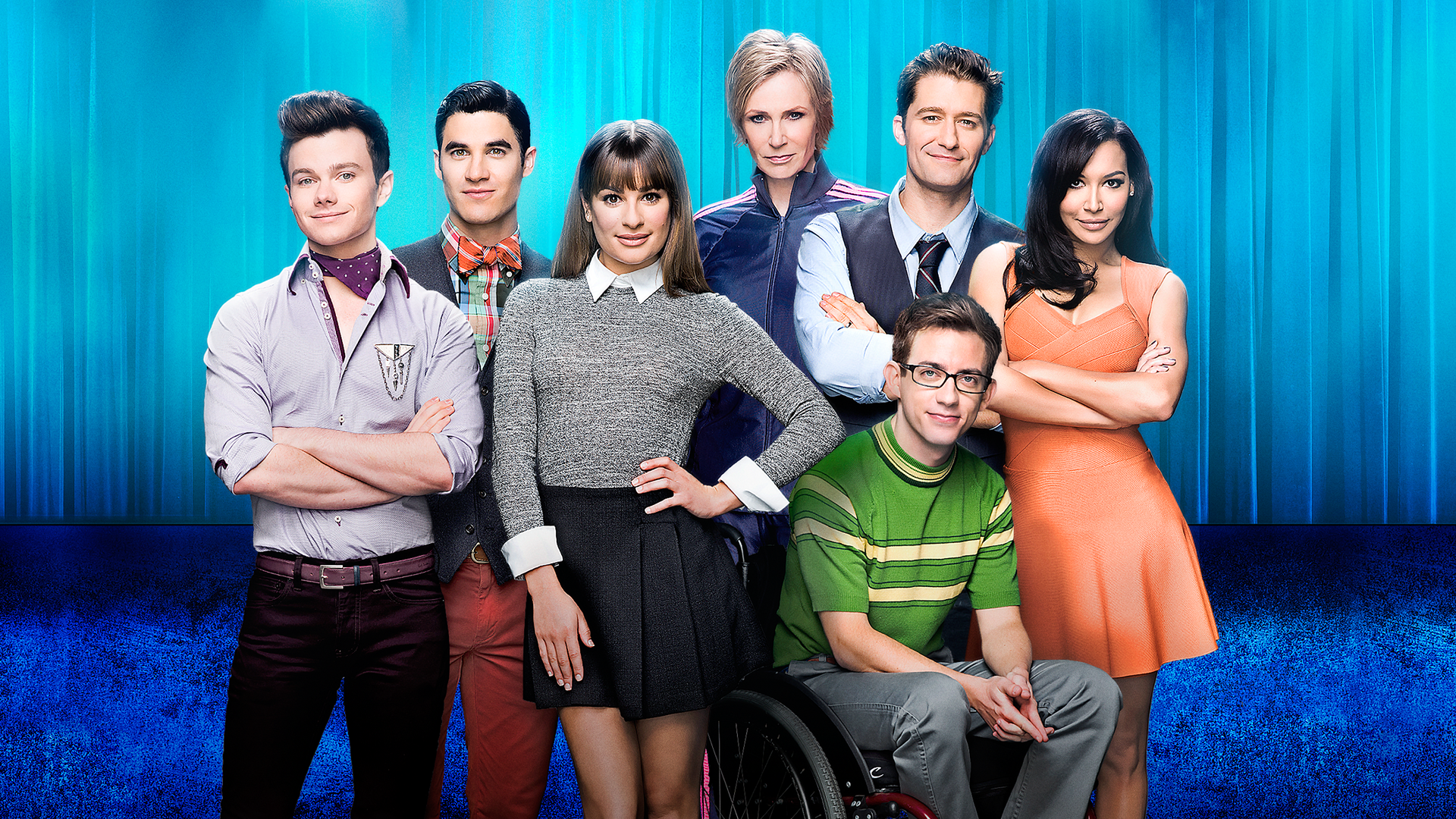 This image features the cast of the musical comedy-drama series Glee, which originally aired from 2009 to 2015.