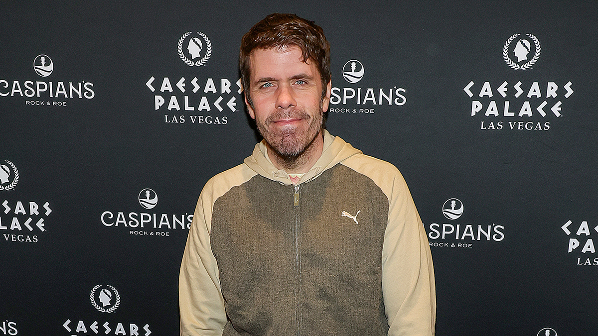 Perez Hilton standing on red carpet