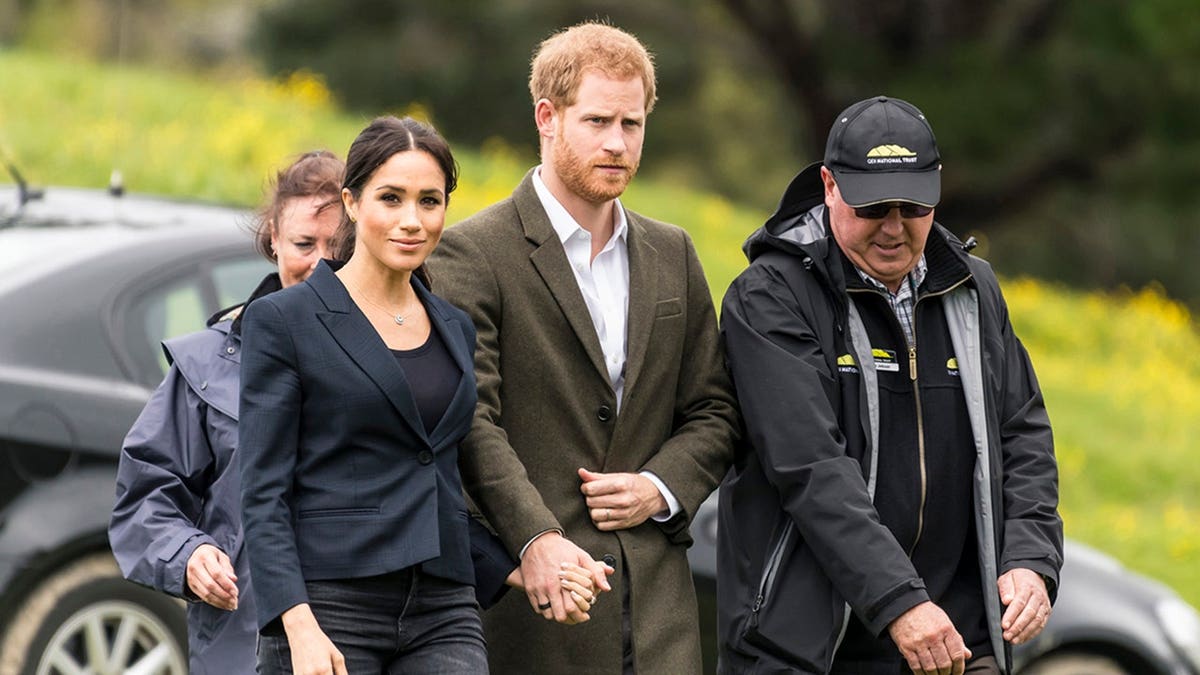 Prince Harry and Meghan, Duchess of Sussex, attend an unveiling in Redvale, New Zealand.