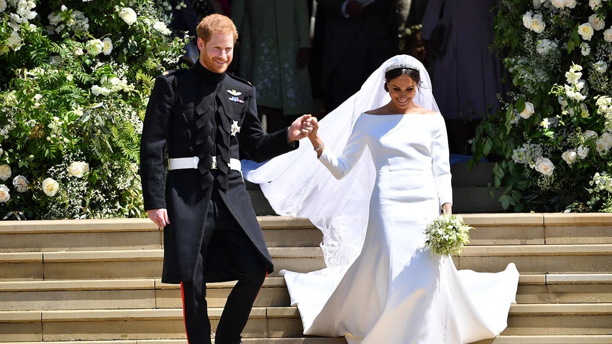 Prince Harry and Meghan emerge from St. George's Chapel after their wedding ceremony at Windsor Castle.