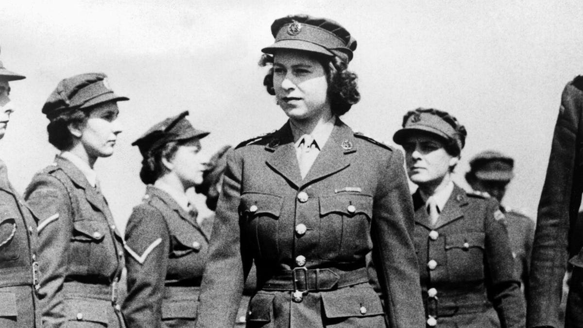 Princess Elizabeth in ATS uniform inspects Motor Transport Training Centre at Camberley.