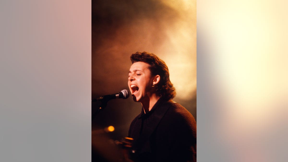 Roland Orzabal of Tears for Fears performs on stage.