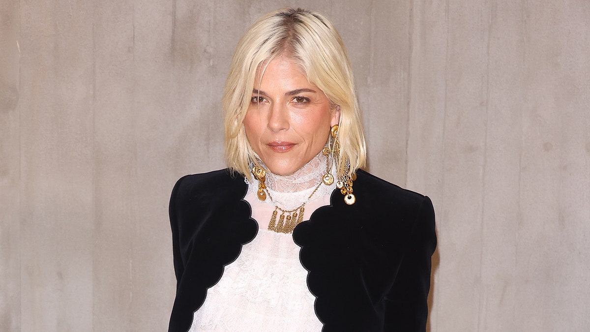 Selma Blair poses in an elegant outfit at the Chloé Womenswear Spring-Summer 2025 show during Paris Fashion Week.