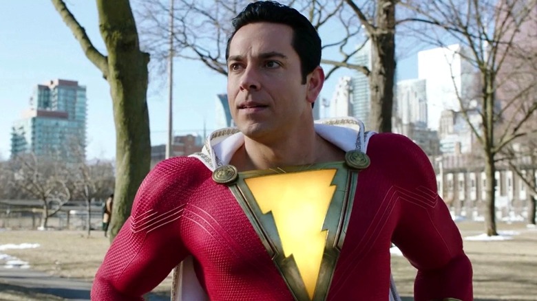 Shazam standing next to some trees