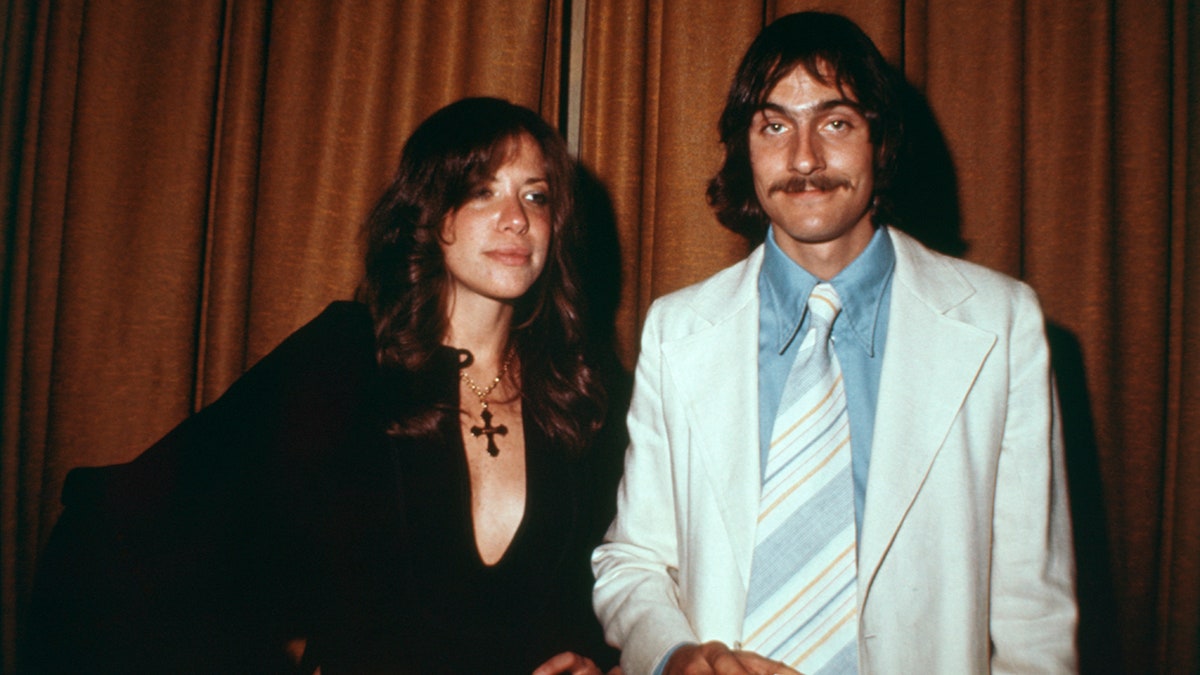 James Taylor poses with Carly Simon at the Waldorf Astoria Hotel.