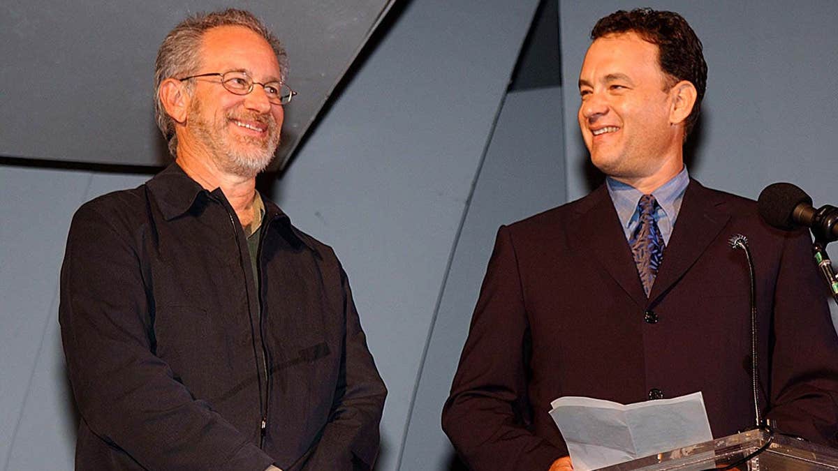 Steven Spielberg and Tom Hanks stand together at HBO's Band of Brothers premiere.