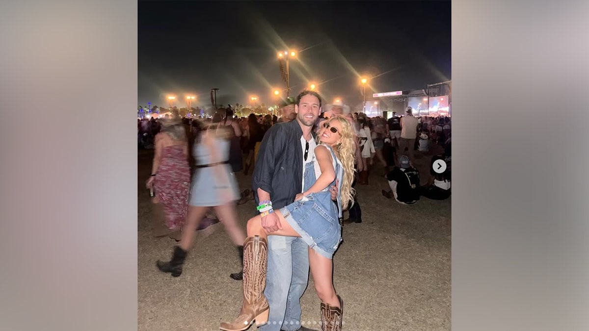 Sydney Sweeney and Scooter Braun in front of the stage at Stagecoach in April 2026.