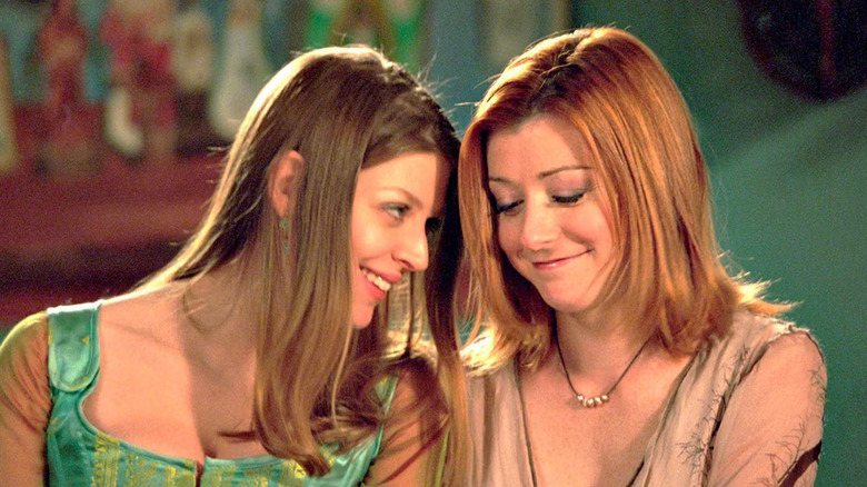 Tara and Willow smiling together in "Buffy the Vampire Slayer"
