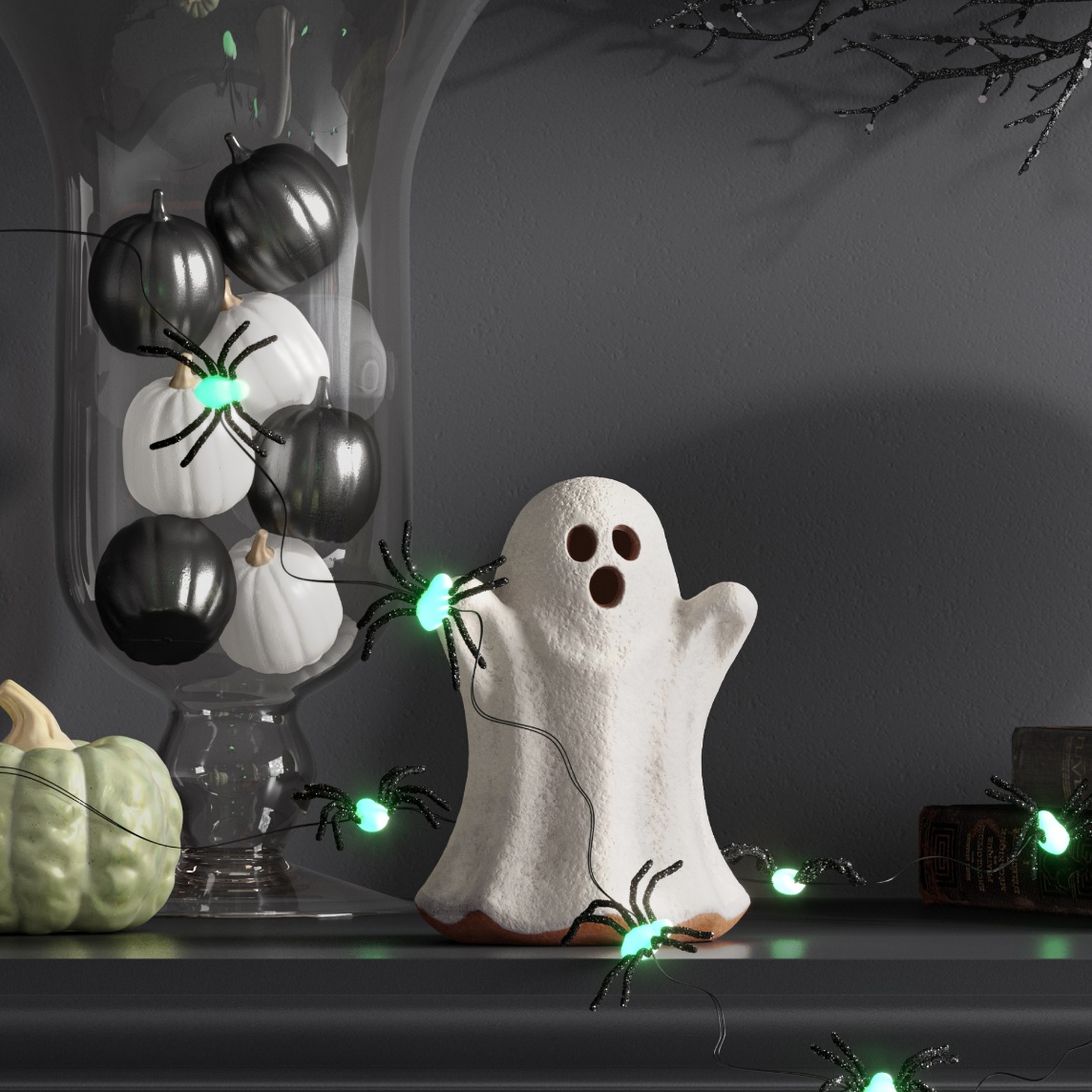 Mantel decorated with a ghost figurine, black and white pumpkins in a glass vase and a string of spider lights.