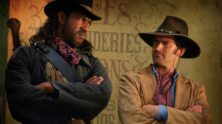 Julius Carry and Bruce Campbell as Lord Bowler and Brisco County, Jr., looking at each other The Adventures of Brisco County, Jr.