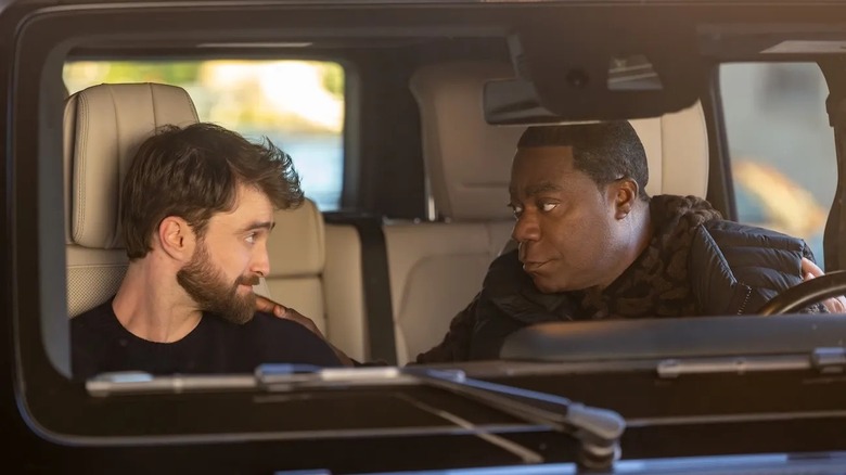 Arthur and Reggie looking at each other in a car in "The Fall and Rise of Reggie Dinkins"