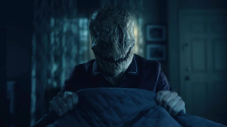 Mr. Smiley holding a duvet on "The Haunting of Hill House."