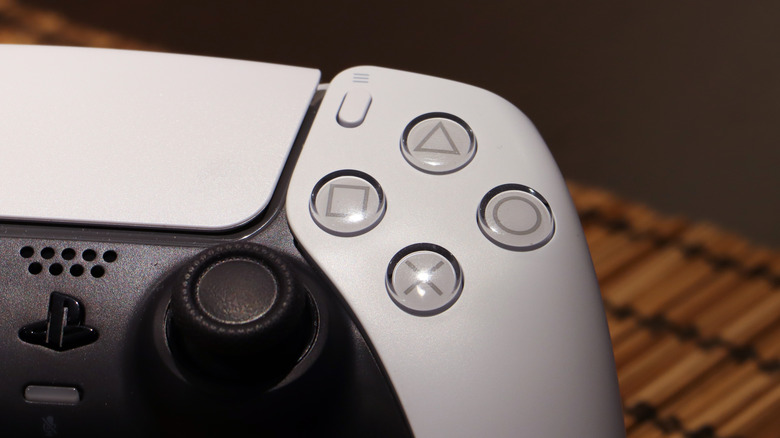 A close-up of the face buttons on the DualSense controller