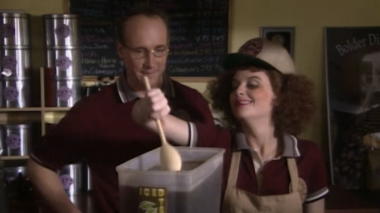 Matt Walsh and Amy Poehler as a cafe boss and prostitute barista looking at a bin of iced tea in Upright Citizens Brigade