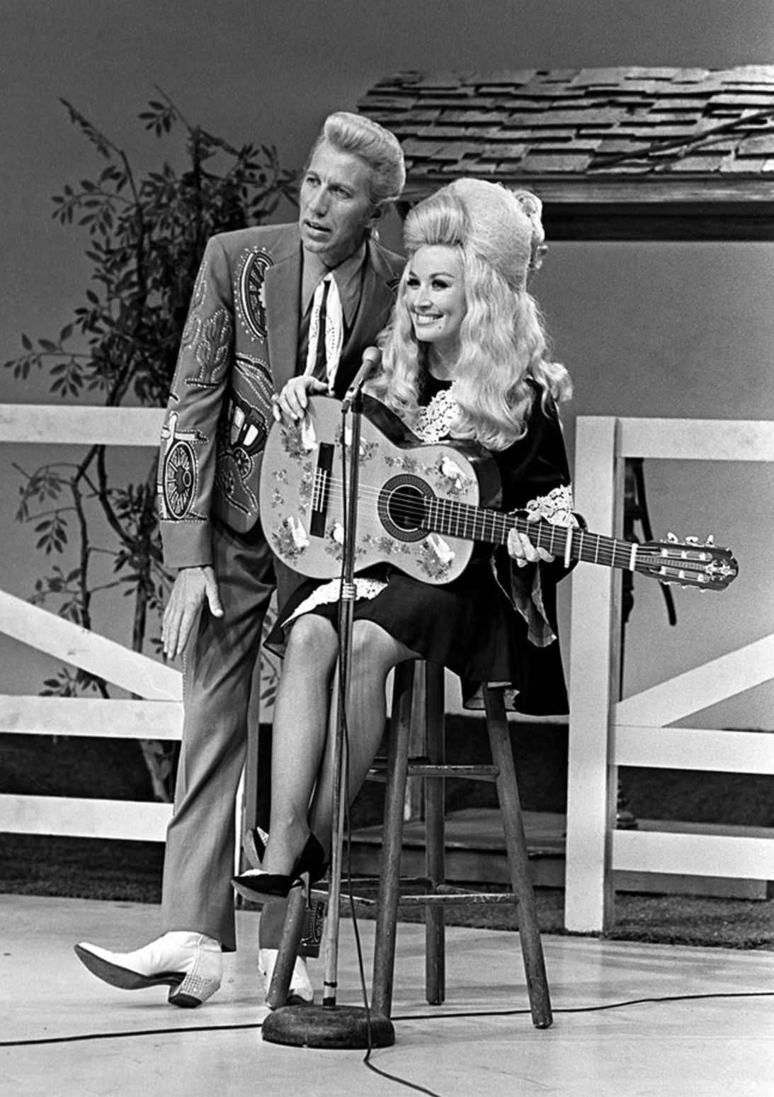 Porter Wagoner, left, talks to Dolly Parton about her next song during the taping of his half hour syndicated television show, The Porter Wagoner Show, at the WSM TV studios.