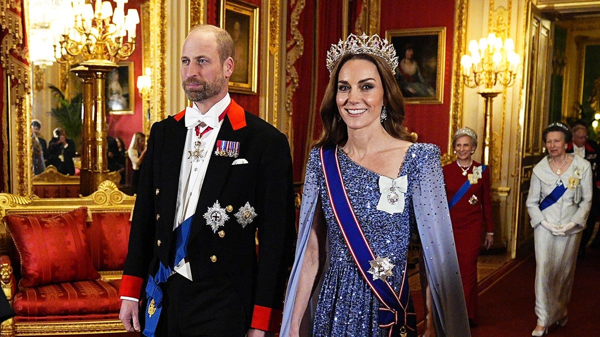 William, Prince of Wales and Catherine, Princess of Wales arrive at Windsor Castle for a state banquet.