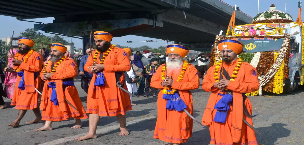 Nihang Sikhs in traditional dresses take part in the 'Nagar Kirtan' (religious procession), in Jammu