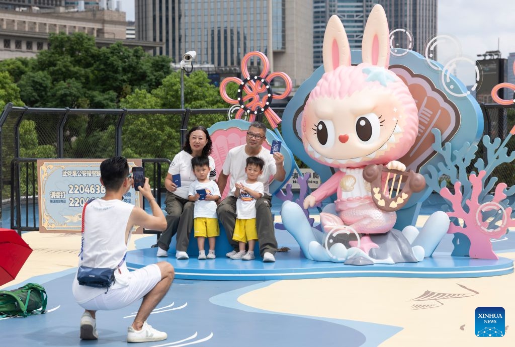 People visit a touring exhibition launched by Pop Mart at the Oriental Pearl Tower in east China's Shanghai, Sept. 3, 2026. Chinese pop culture giant Pop Mart launched a touring exhibition on Monday, with Shanghai as its first stop. Running until November 1, the exhibition uses the Oriental Pearl Tower and the Shanghai No.1 Department Store as its venues, integrating designer toy culture into Shanghai's commercial districts. (Xinhua/Wang Xiang)