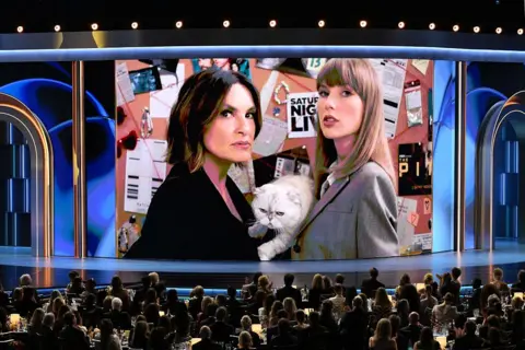 Getty Images US director Mariska Hargitay and US singer Taylor Swift and her cat Olivia Benson appear on screen during the 78th Primetime Emmy Awards at the Peacock Theatre at LA Live in Los Angeles on September 14, 2026.