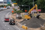 Construction takes place on Interstate 5 southbound on the first full day I-5 is closed through the Rose Quarter for repairs for five weeks, in Portland, Ore., on Sept. 12, 2026.