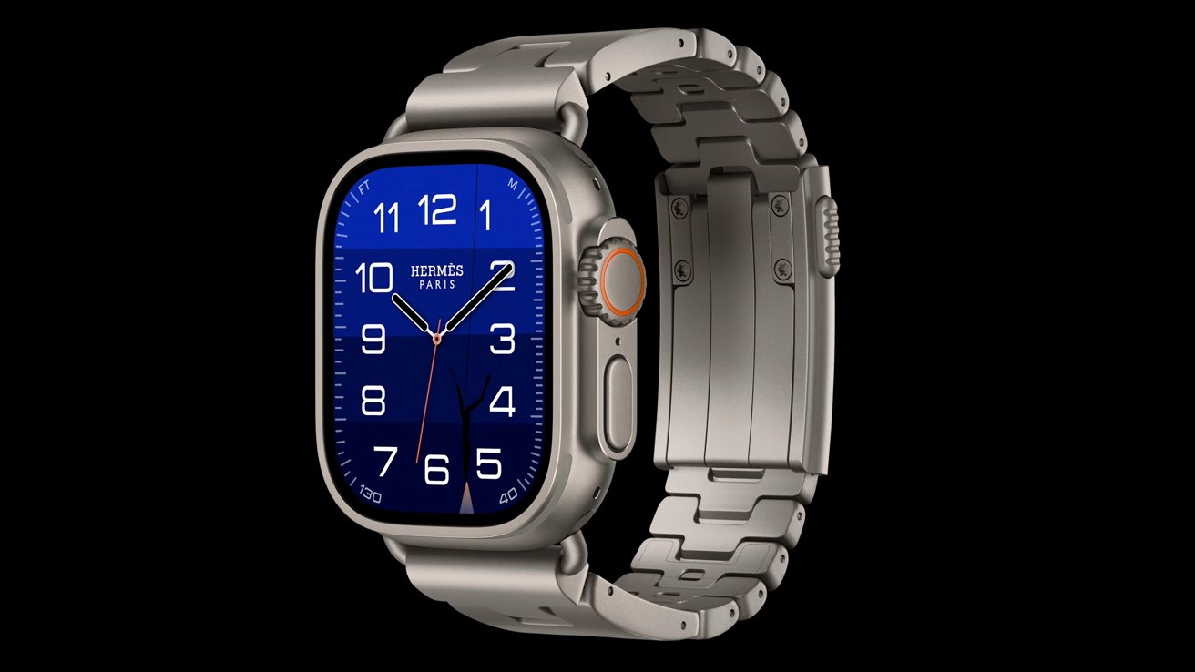 Smartwatch with rectangular silver metal case and bracelet, bright blue watch face, white Arabic numerals, and slim hands, shown against a plain black background