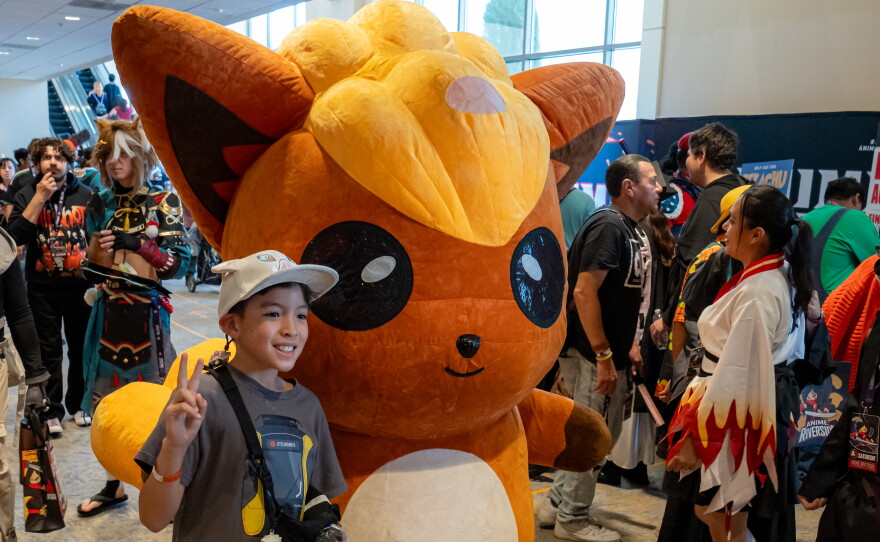 Anime Riverside attendee earlier this year with costumed character Vulpix from Pokemon. Undated photo.