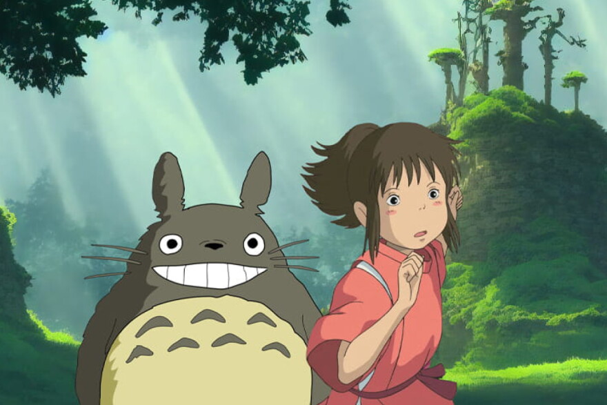 An anime style image of a smiling animal-like form that resembles a rabbit and child who appears to be running