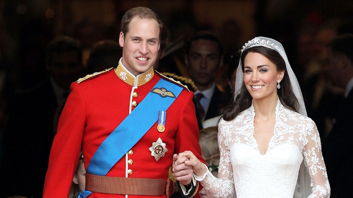 Prince William and Catherine smile after their wedding at Westminster Abbey.